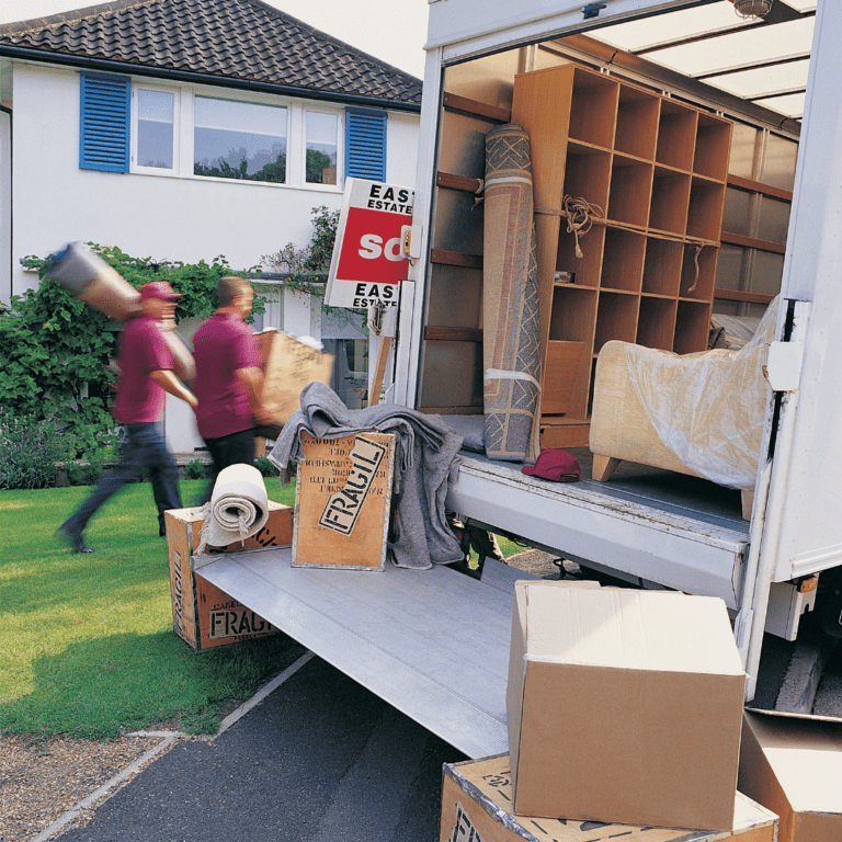 back of a moving van with boxes and furniture being moved into a home Arth Real Estate Group Wilmington North Carolina